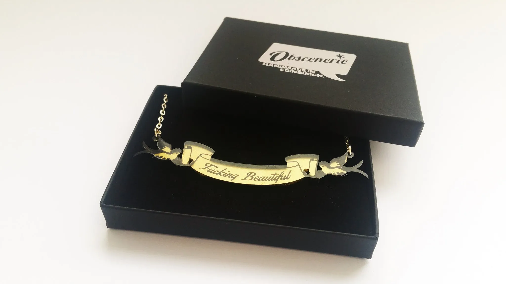 Fucking Beautiful swallow and scroll necklace