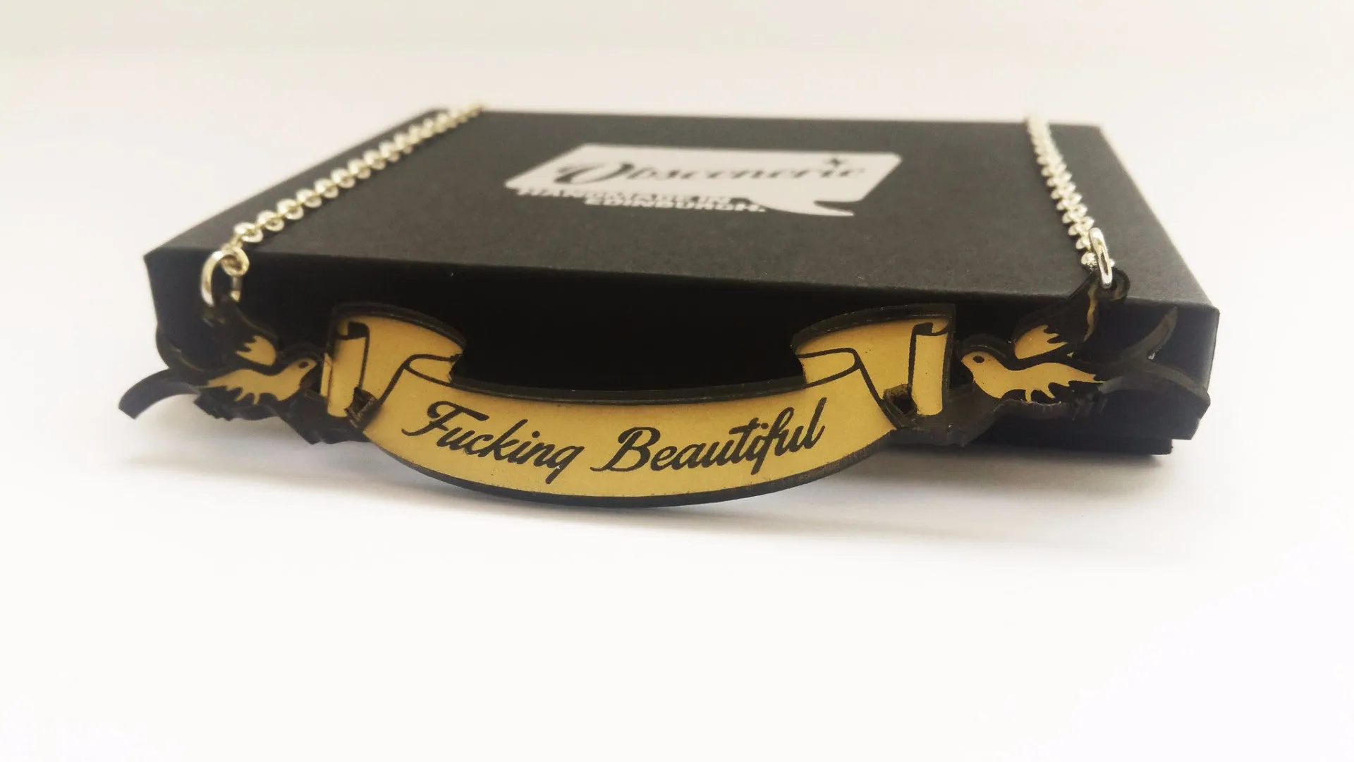 Fucking Beautiful swallow and scroll necklace