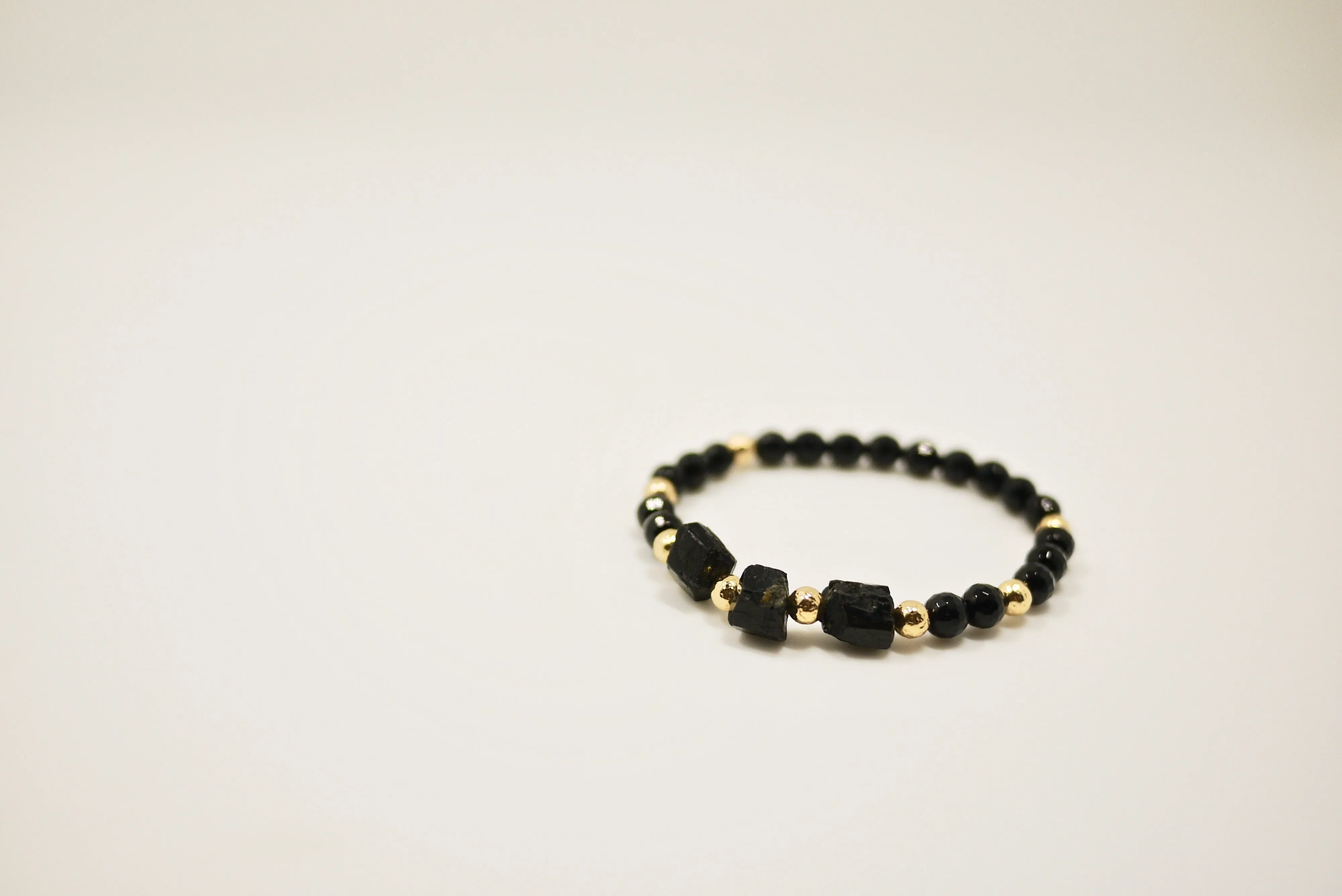 Women's Lava Stone, Onyx, and Gold Beads Bracelet